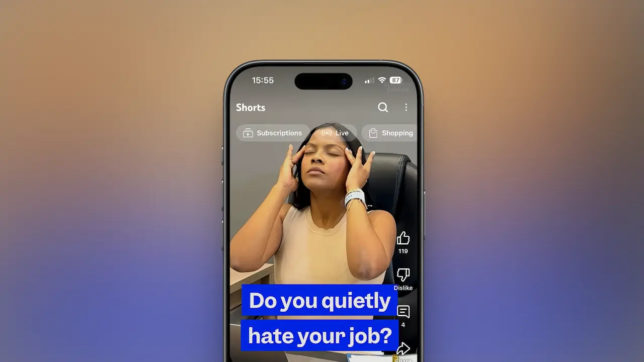 A woman sitting in an office chair with her eyes closed, massaging her temples in frustration, illustrating workplace burnout. The caption on the phone screen reads “Do you quietly hate your job?” — representing an ESL lesson plan on quiet cracking, job dissatisfaction, and mental health at work. Perfect visual for a B2 business English lesson focused on work-related stress, motivation, and emotional well-being.