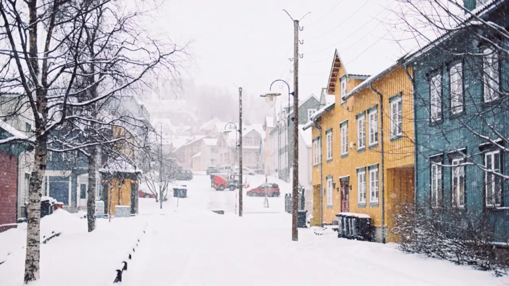 A snowy street with historic buildings showing winter weather esl lesson contextual imagery for A2 learners