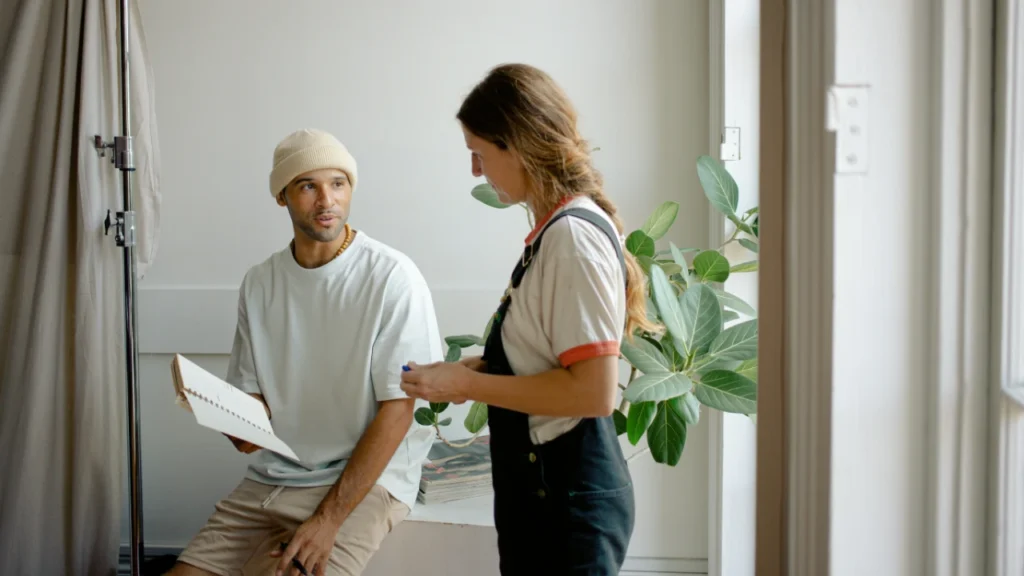 Young professionals collaborating at work - jobs A2 lesson plan cover image showing first workplace experiences and teamwork.