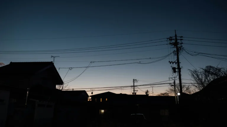 Winter power outage at night showing darkened neighborhood skyline - upper-intermediate ESL lesson plan about blackout survival preparedness