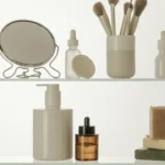 Skincare products on glass shelves: serum bottles, a mirror, makeup brushes, a pump cleanser, and soap bars. A2 lesson skincare.